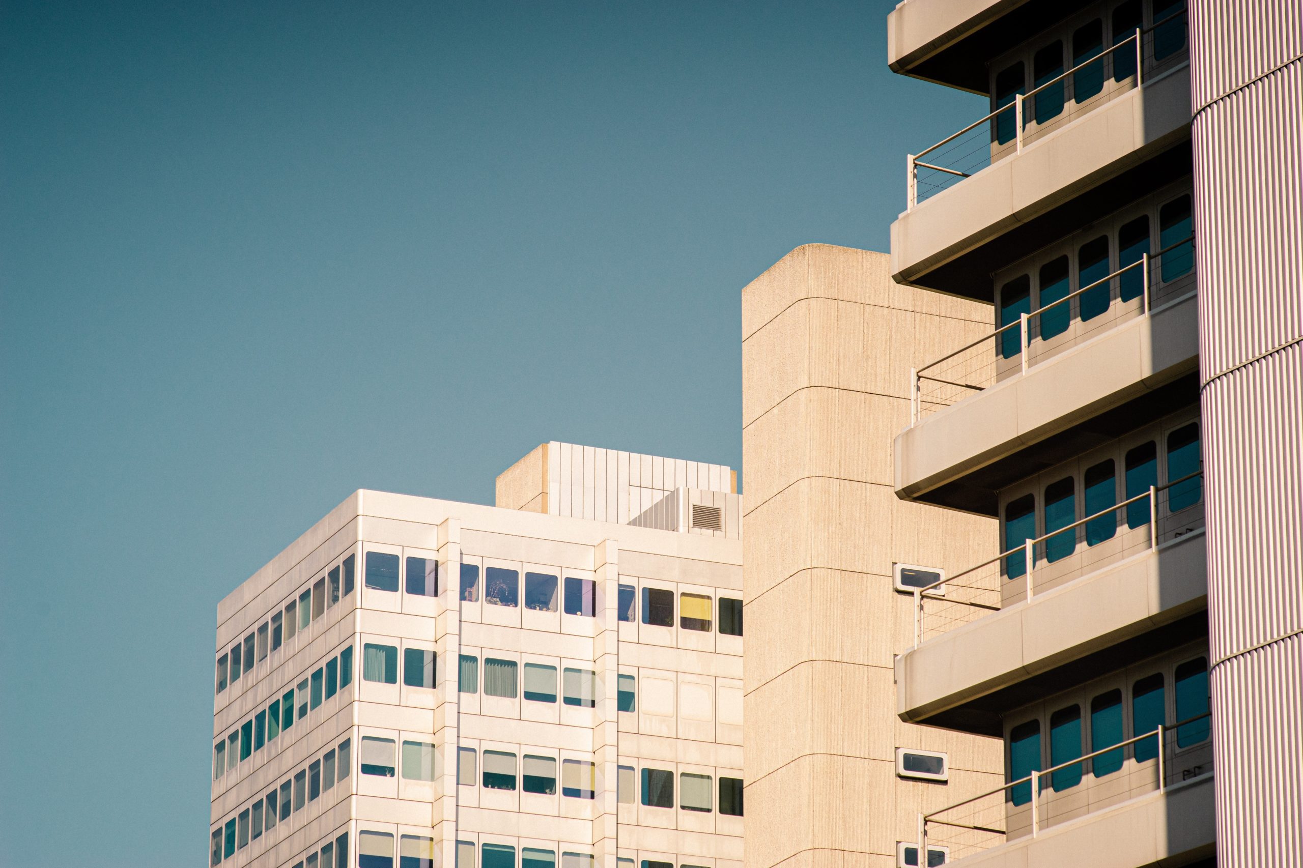 Photo by Paul Volkmer: https://www.pexels.com/photo/beige-building-with-balconies-during-day-2976190